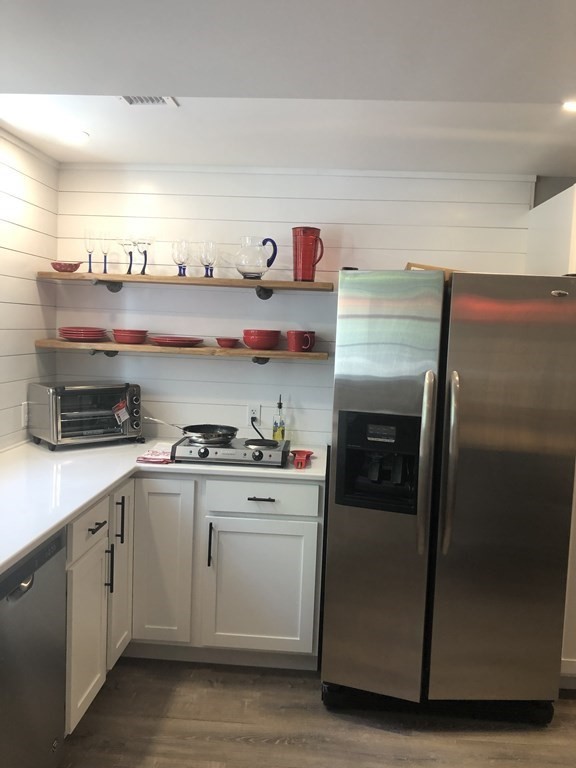 1 Park Road, Unit 1 Sandwich, MA 02644 - Photo 5 of 25 a kitchen with a refrigerator and cabinets