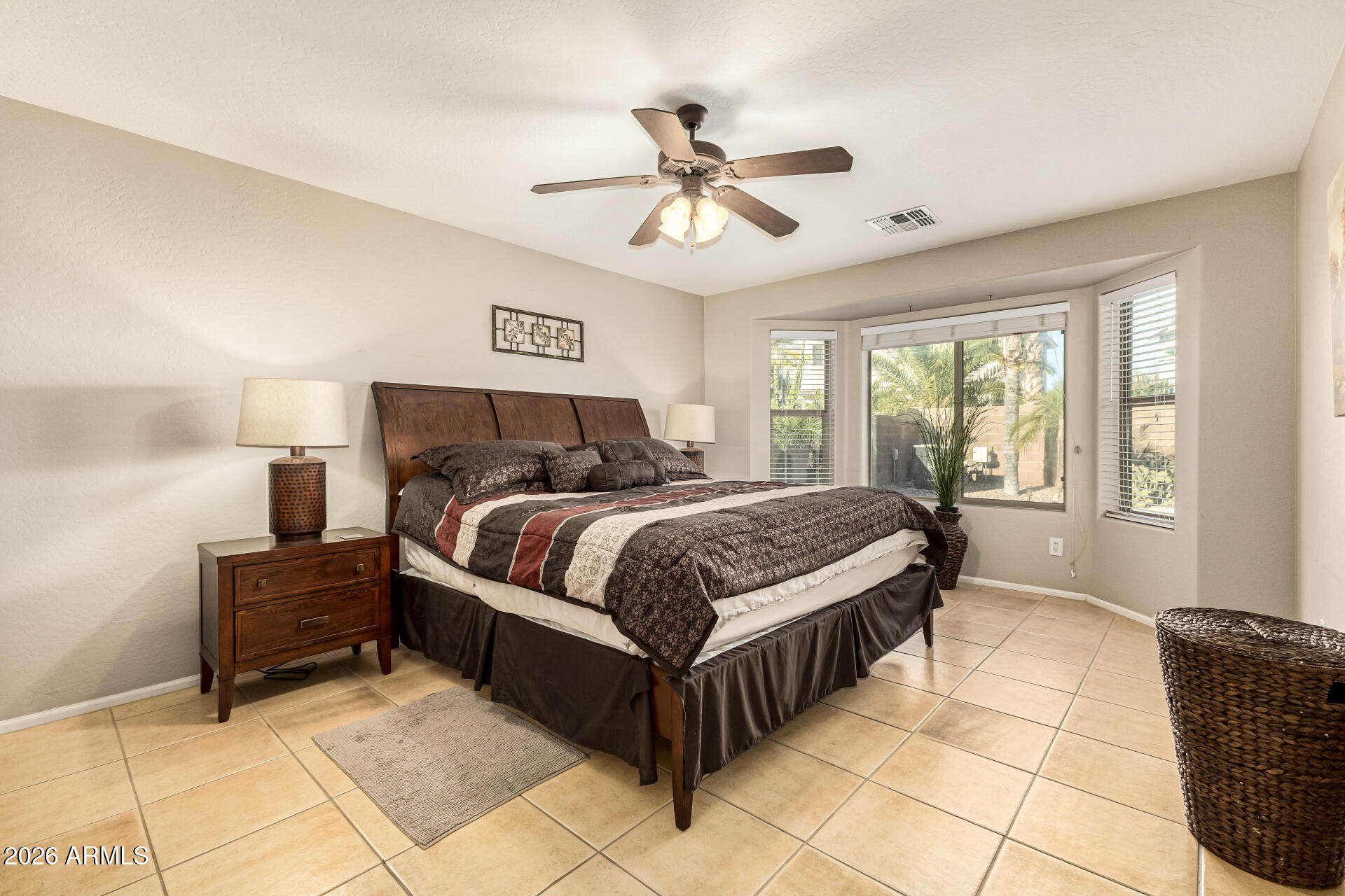 45144 West Desert Garden Road Maricopa, AZ 85139 - Photo 14 of 52 a bedroom with a bed and window