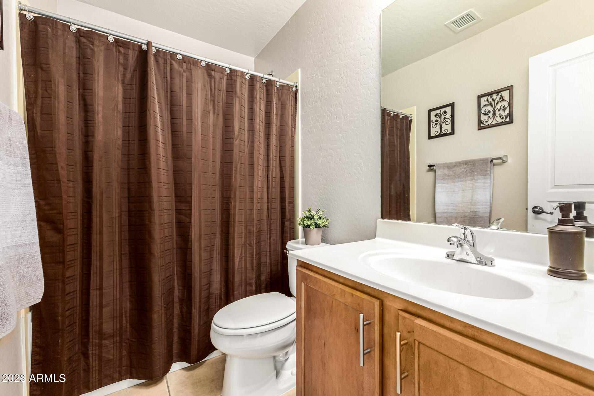 45144 West Desert Garden Road Maricopa, AZ 85139 - Photo 35 of 52 a bathroom with a sink a toilet and shower