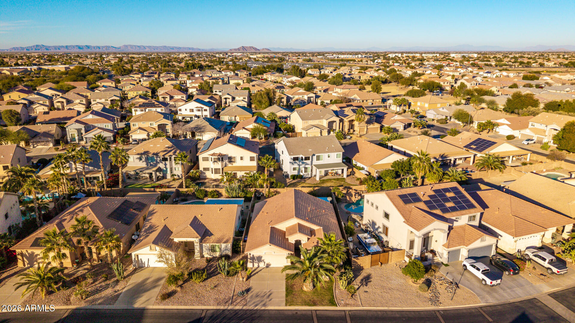 45144 West Desert Garden Road Maricopa, AZ 85139 - Photo 39 of 52 an aerial view of residential houses with outdoor space