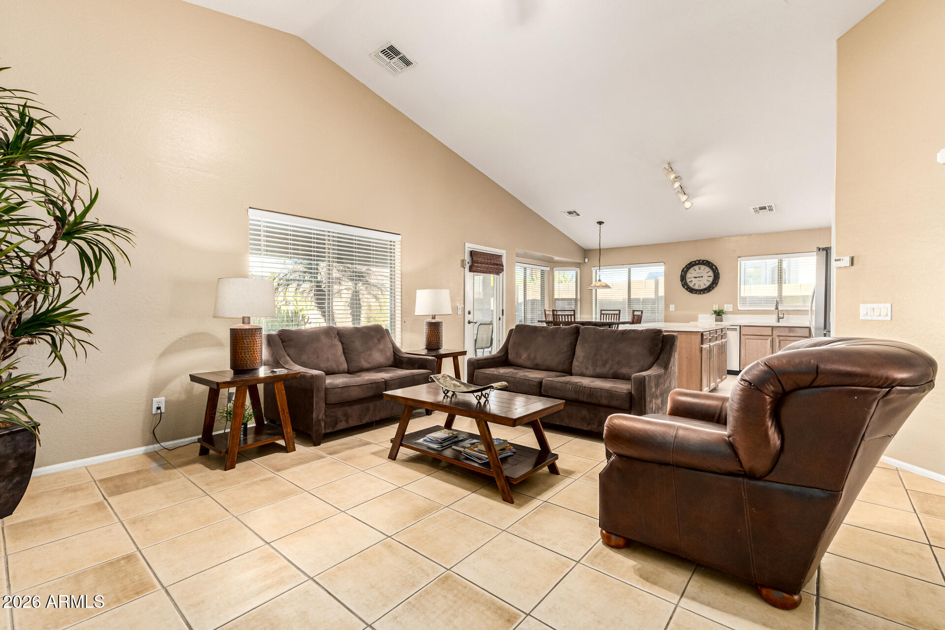 45144 West Desert Garden Road Maricopa, AZ 85139 - Photo 6 of 52 a living room with furniture and a large window