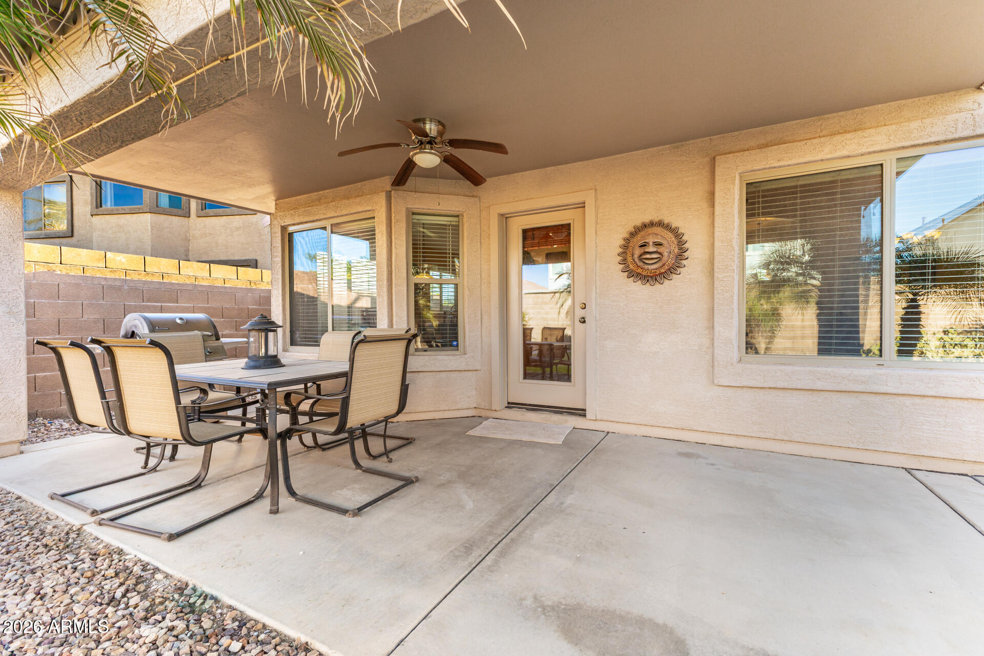 45144 West Desert Garden Road Maricopa, AZ 85139 - Photo 8 of 52 a view of a dining room with furniture and chandelier