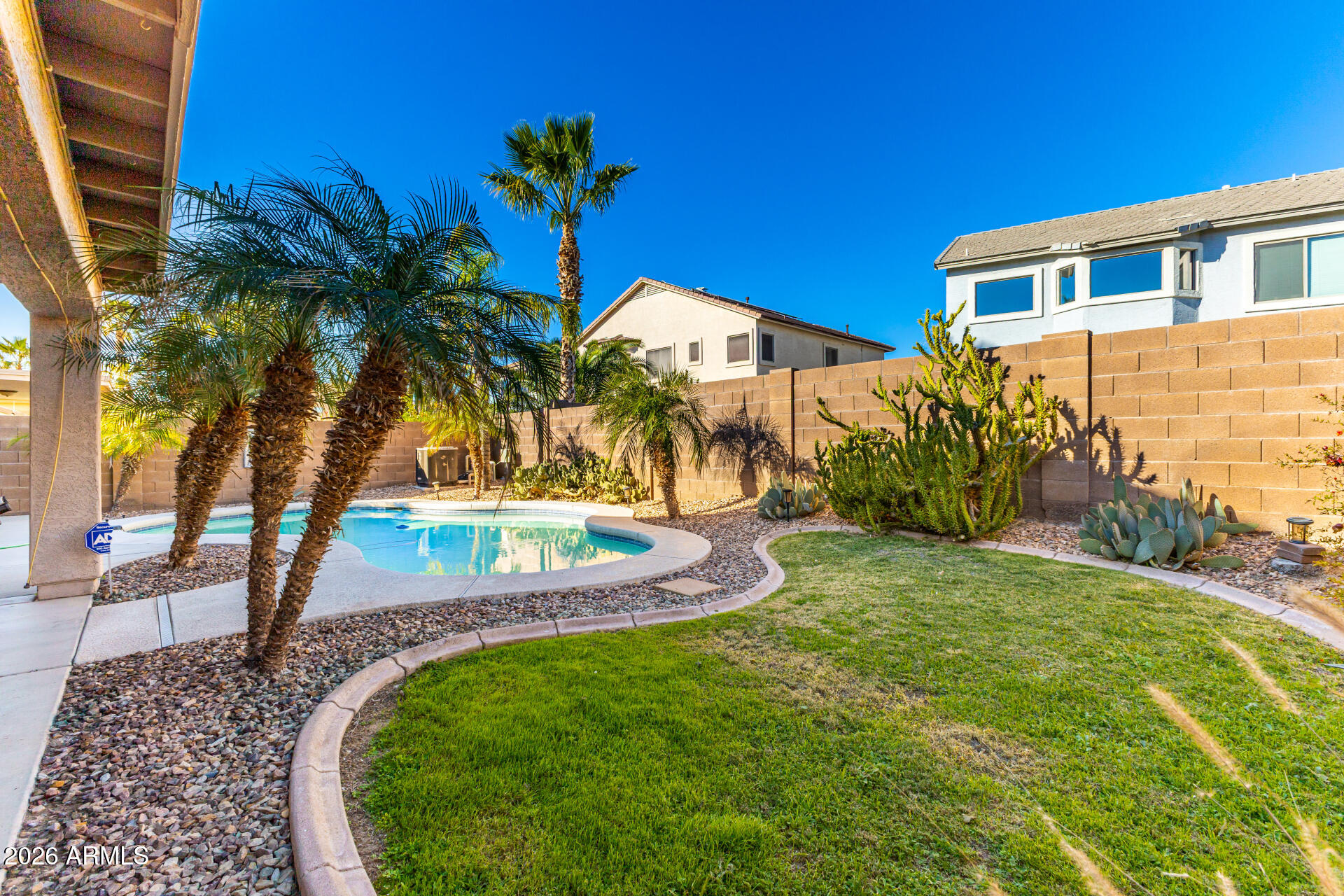45144 West Desert Garden Road Maricopa, AZ 85139 - Photo 10 of 52 a view of a backyard with a garden