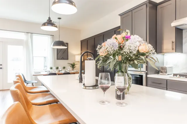 a kitchen with a sink stove and cabinets