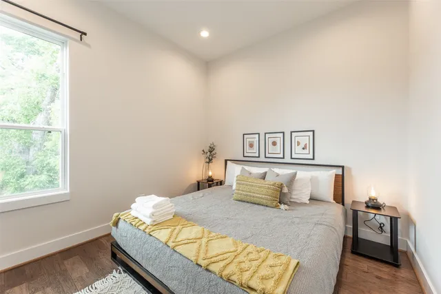 a bedroom with a bed and window