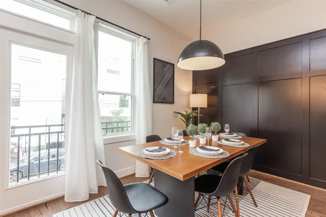 a dining room with a table and chairs