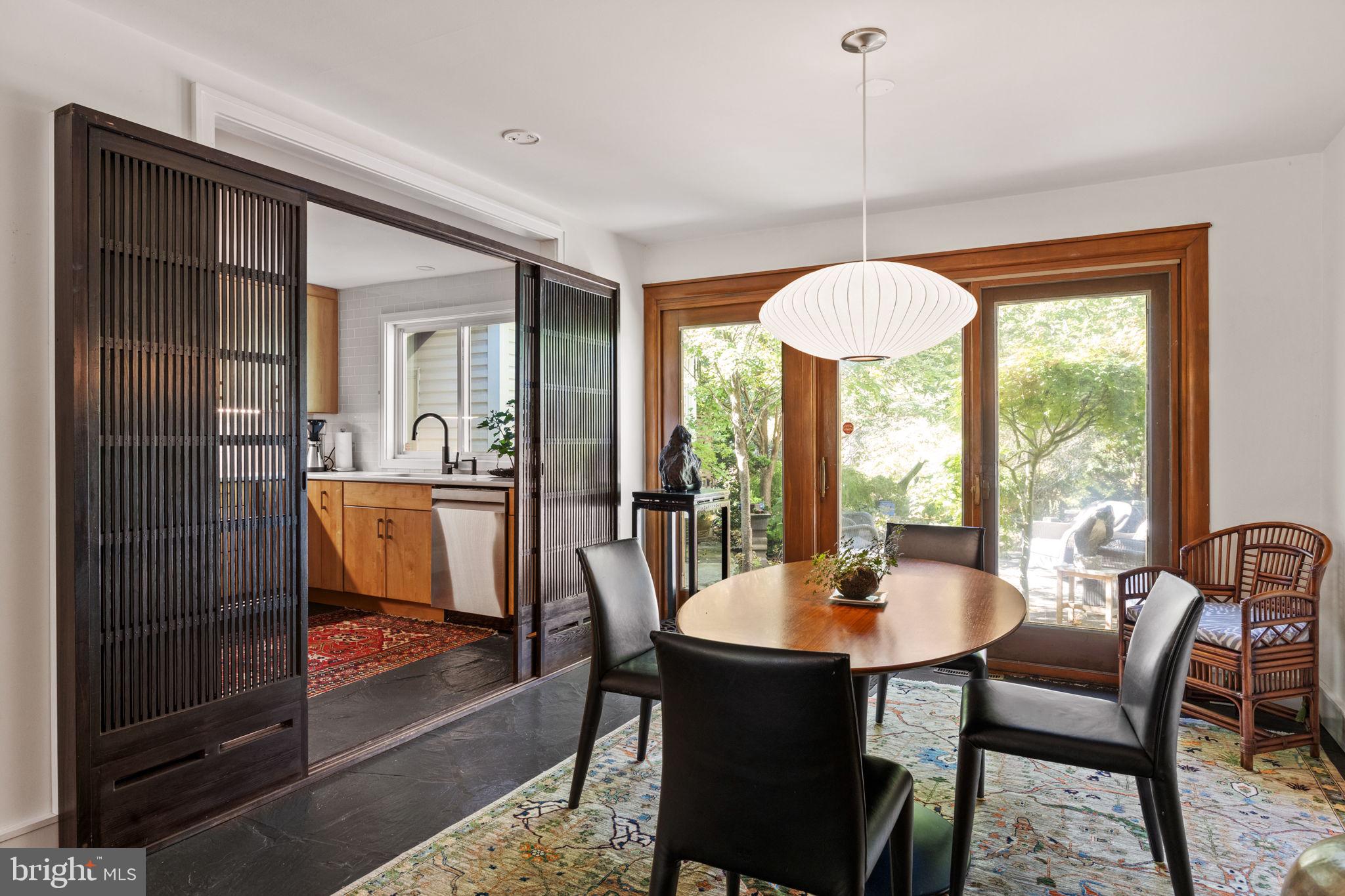 303 Glenway Road Glenside, PA 19038 - Photo 12 of 56 a dining room with furniture a chandelier and wooden floor