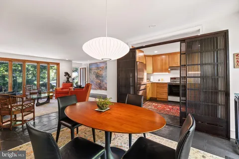 a view of a dining room with furniture window and outside view