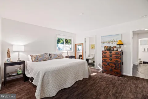 a bedroom with a bed and a closet