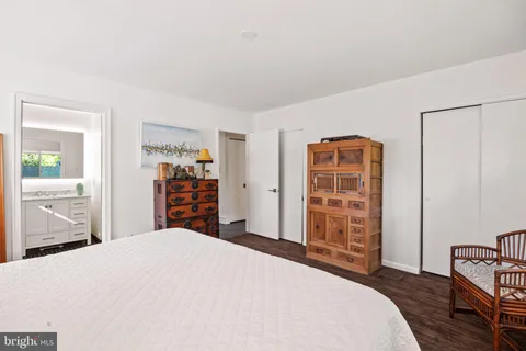 a bedroom with a bed and a dresser