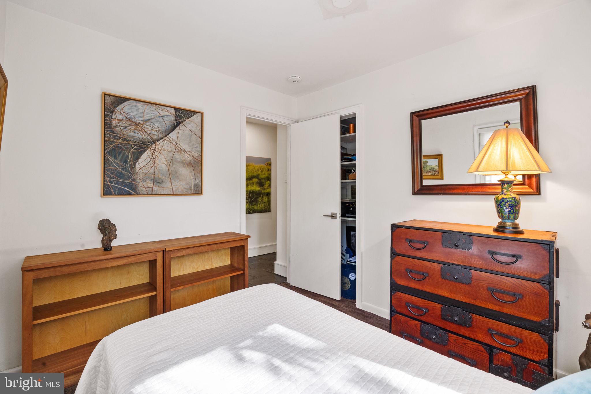 303 Glenway Road Glenside, PA 19038 - Photo 23 of 56 a bedroom with a bed and a lamp on dresser