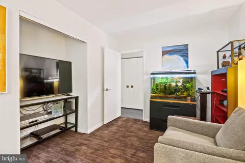 a view of a hallway with paintings on the wall