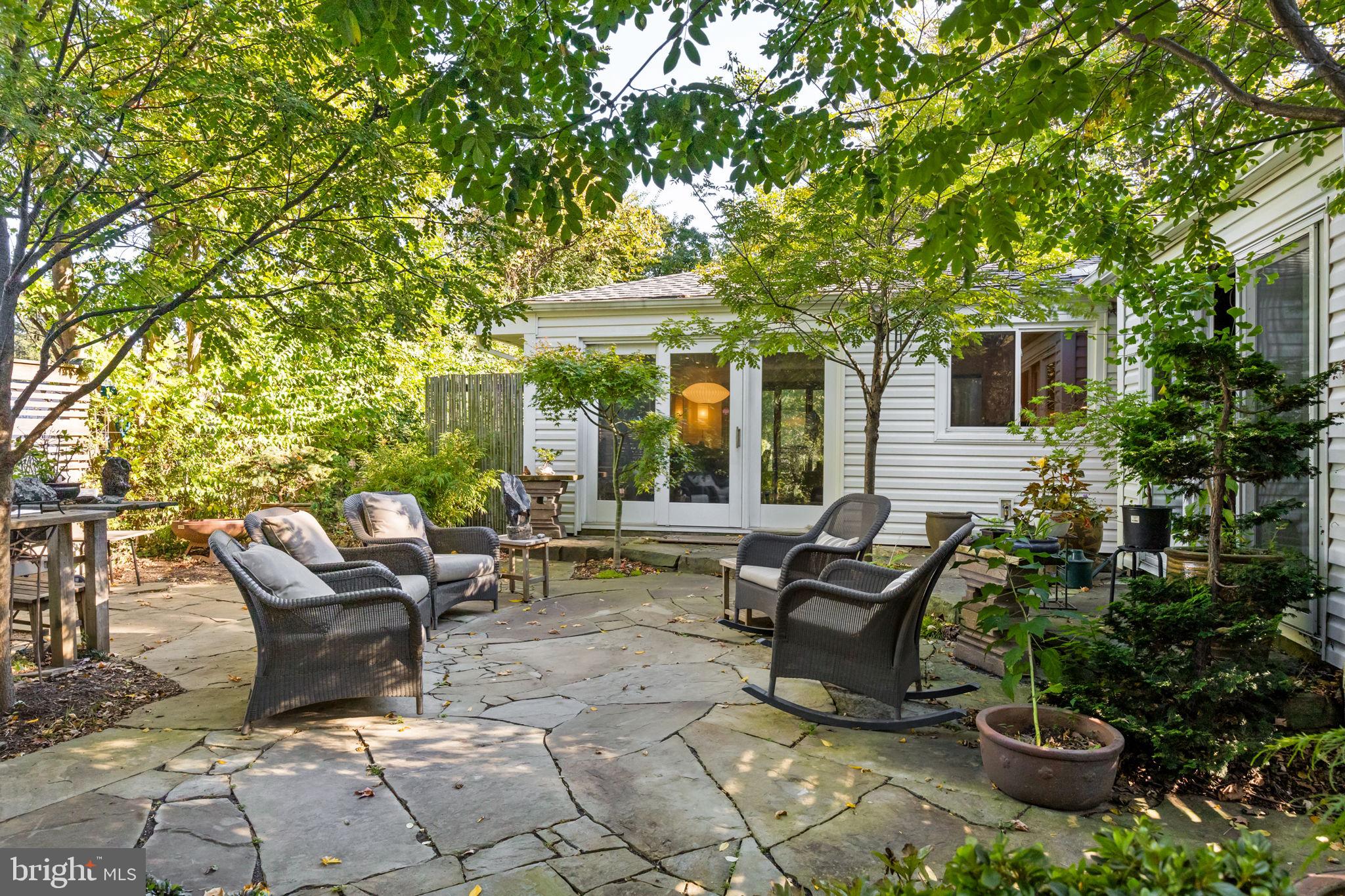 303 Glenway Road Glenside, PA 19038 - Photo 33 of 56 a view of a patio with table and chairs potted plants and large tree