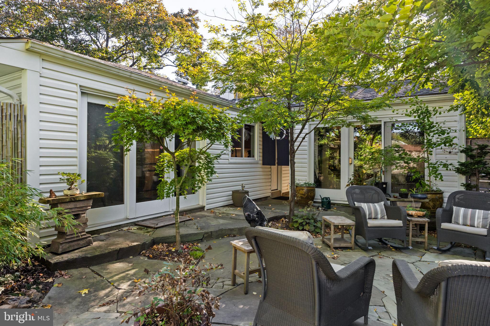 303 Glenway Road Glenside, PA 19038 - Photo 34 of 56 a view of a patio with couches table and chairs and potted plants