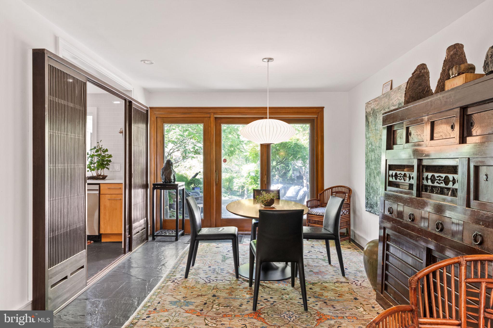 303 Glenway Road Glenside, PA 19038 - Photo 10 of 56 a dining room with furniture a rug and a floor to ceiling window