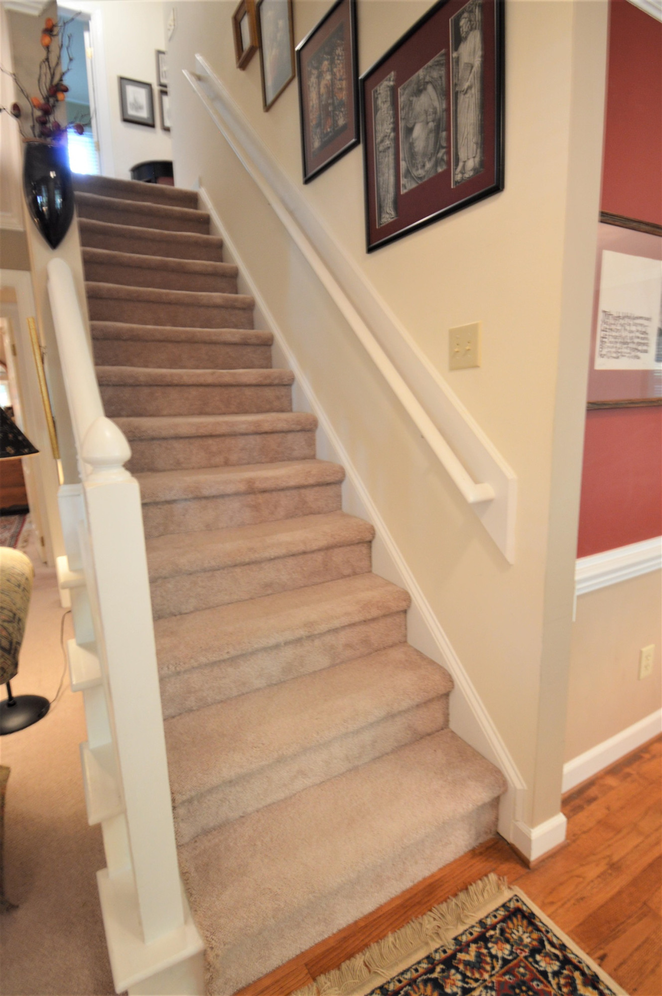7008 Sandringham Drive Raleigh, NC 27613 - Photo 19 of 52 The floors in the entrance foyer are site-finished hardwood. Stairs to Second Level