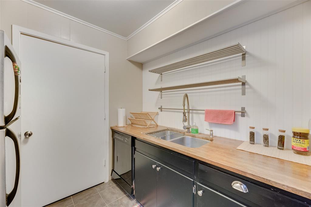 419 Marietta Street Denton, TX 76201 - Photo 11 of 20 a bathroom with a sink and a mirror