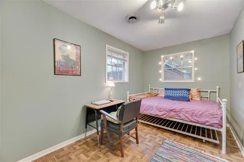 a bedroom with a bed and a table