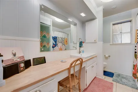 a kitchen with a sink a stove and cabinets