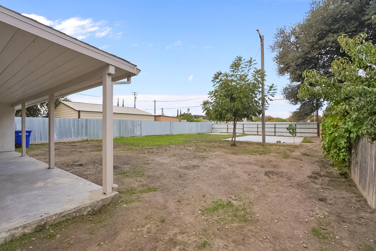 1715 Dallas Street Modesto, CA 95358 - Photo 27 of 35 a view of a back yard with wooden fence