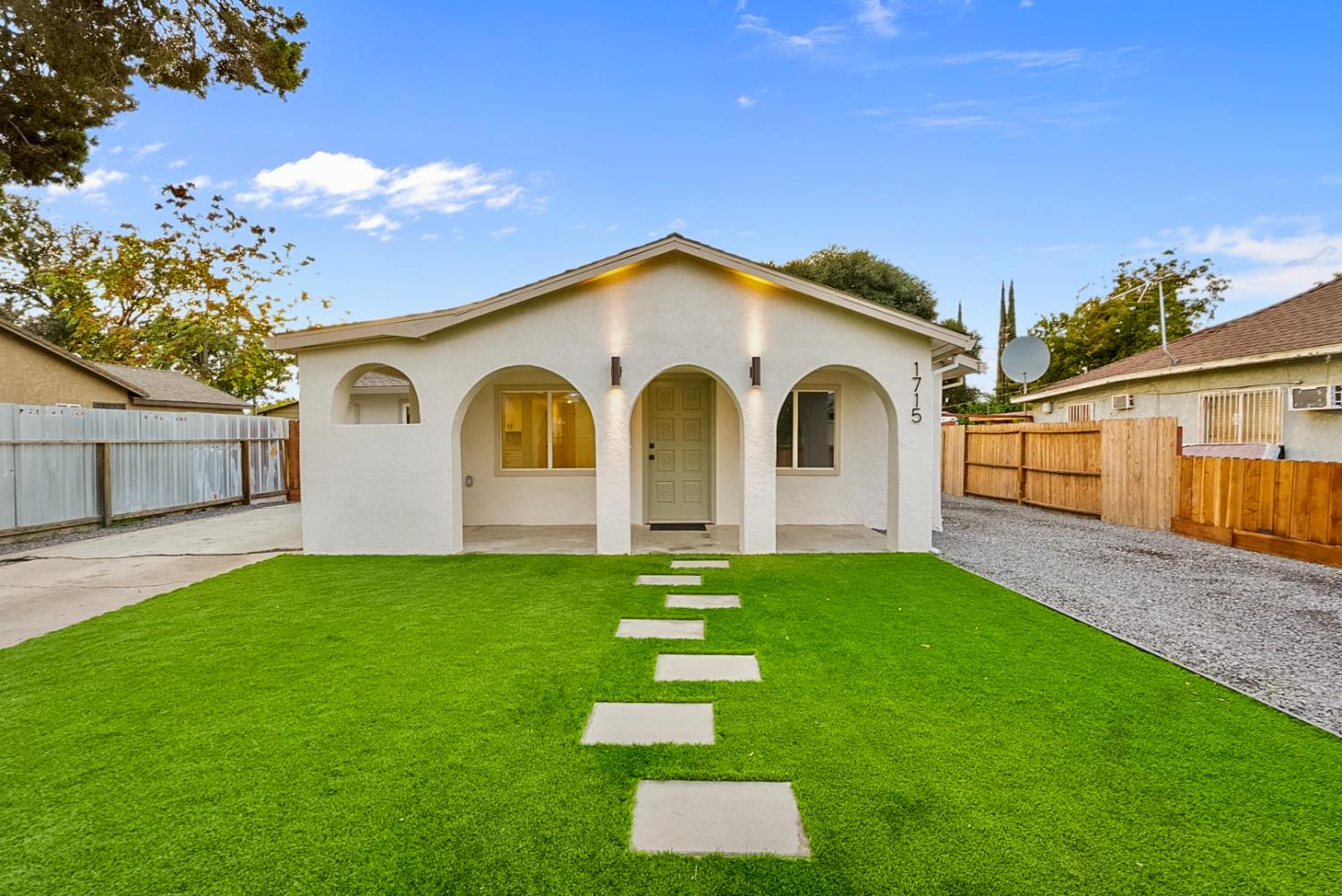 1715 Dallas Street Modesto, CA 95358 - Photo 3 of 35 a front view of a house with a yard