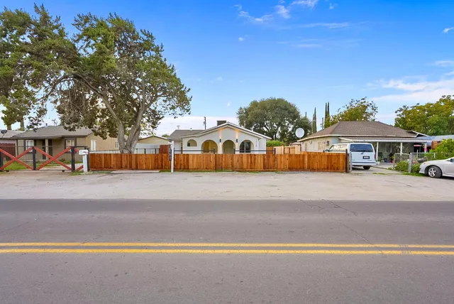 a view of street with parked cars