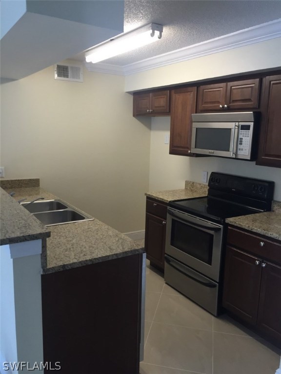 a kitchen with a stove and a microwave