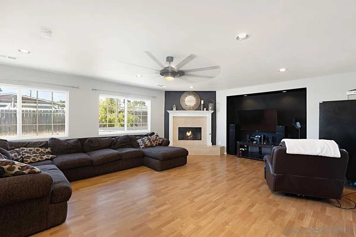 9416 Pike Road Santee, CA 92071 - Photo 6 of 25 a living room with furniture a flat screen tv and a large window