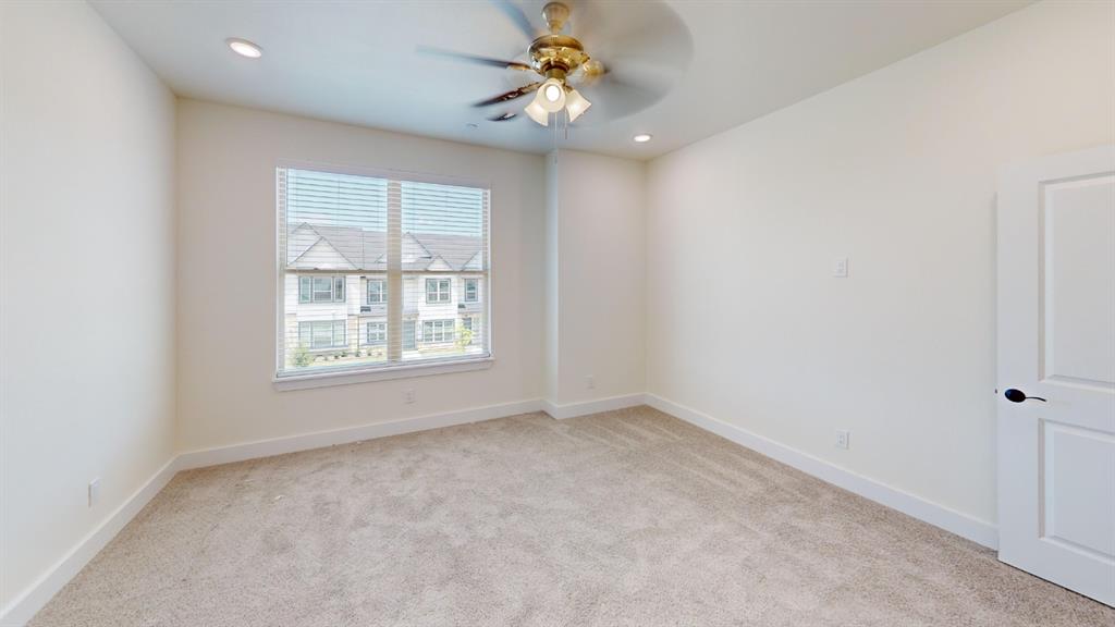 313 Buck Ridge Drive Frisco, TX 75068 - Photo 8 of 20 Neutral-toned carpeting paired with white walls, a contemporary ceiling fan, and recessed lighting