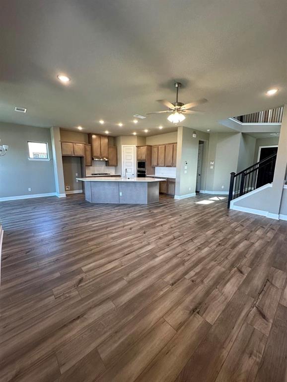 2525 Four Roses Drive Lewisville, TX 75056 - Photo 5 of 19 a large kitchen with stainless steel appliances granite countertop a large counter top and a stove