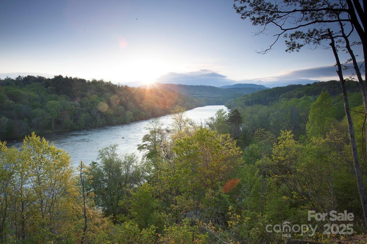 215 Old Macedonia Road Asheville, NC 28804 - Photo 20 of 32 a view of a lake in middle of forest