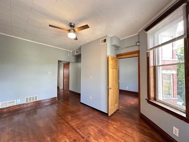 a view of an empty room with a window