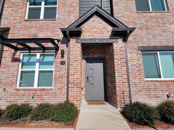 a front view of a house with garage