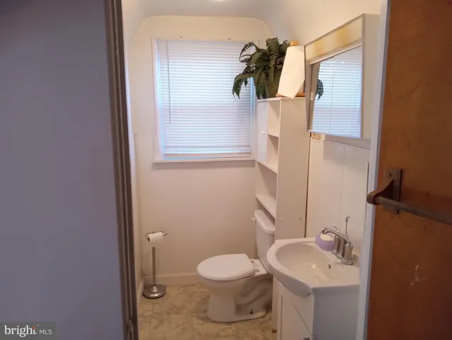 a bathroom with a sink and toilet