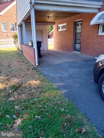 a view of empty room with window and fireplace