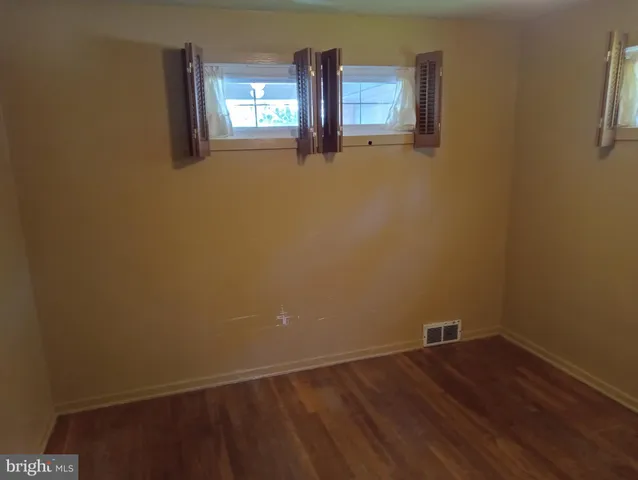 a view of empty room with windows