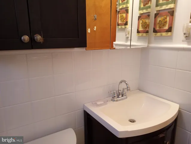 a bathroom with a sink and mirror