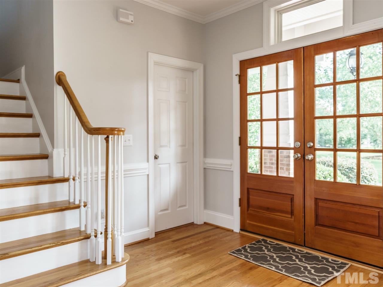 95 Rand Road Raleigh, NC 27603 - Photo 2 of 25 a view of entryway with stairs and wooden floor