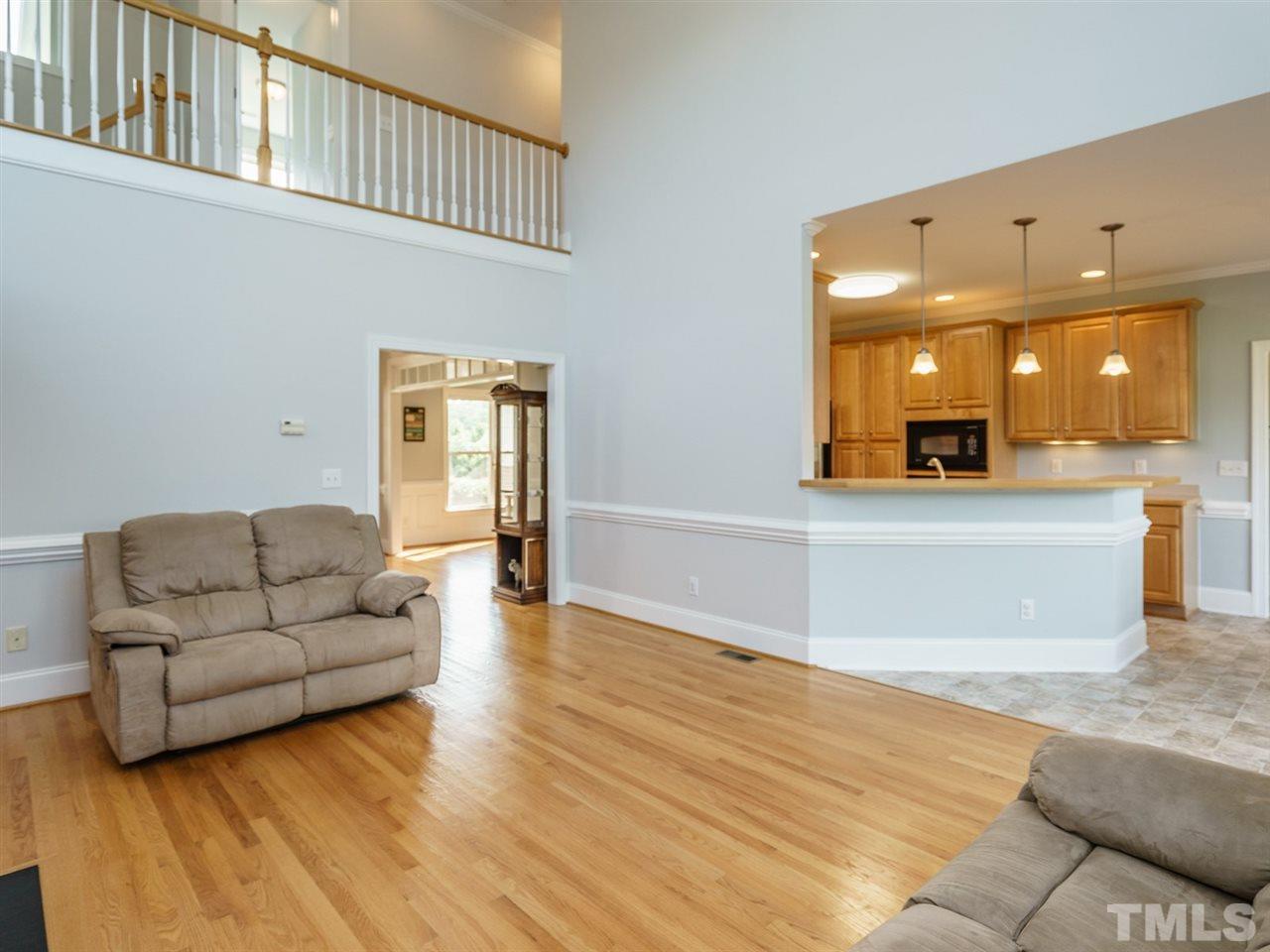 95 Rand Road Raleigh, NC 27603 - Photo 10 of 25 a living room with furniture and a wooden floor