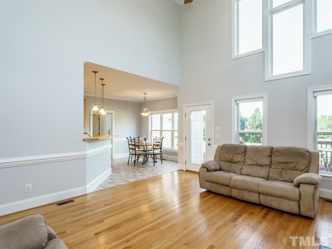 95 Rand Road Raleigh, NC 27603 - Photo 11 of 25 a living room with furniture and a wooden floor