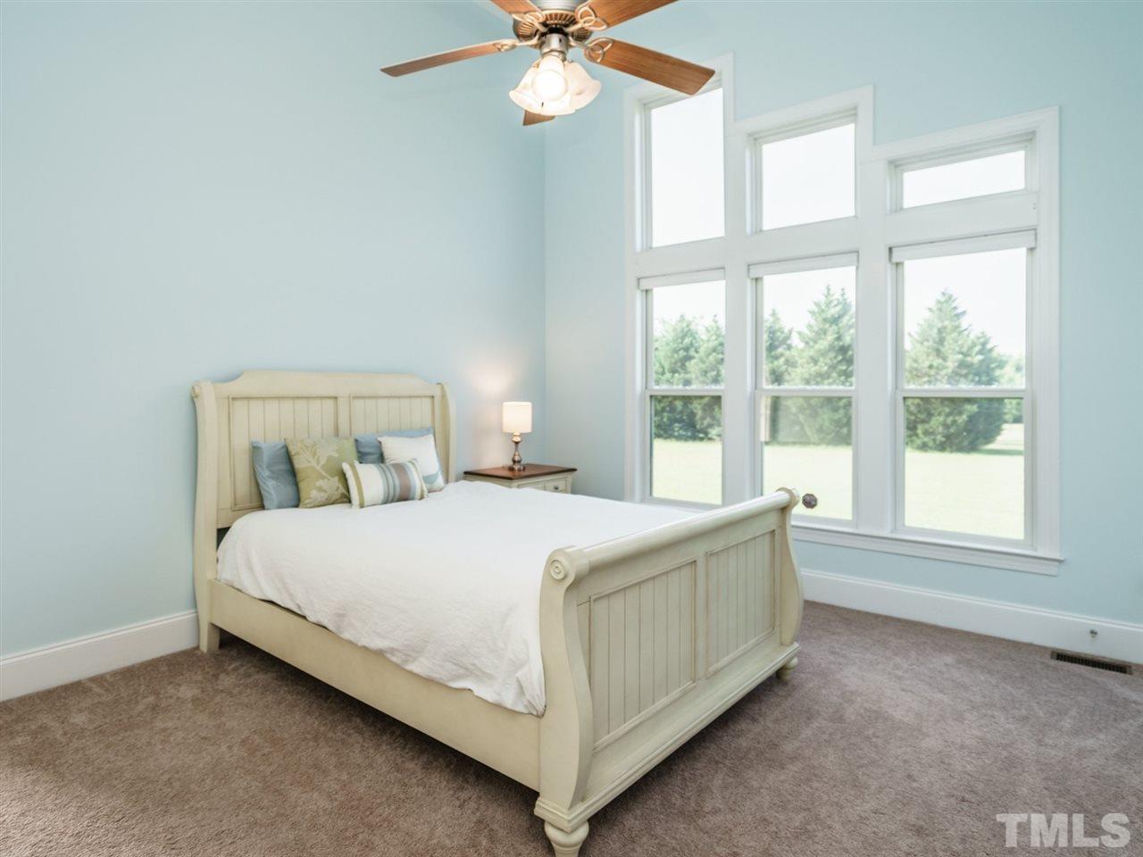 95 Rand Road Raleigh, NC 27603 - Photo 12 of 25 a bedroom with a bed and window