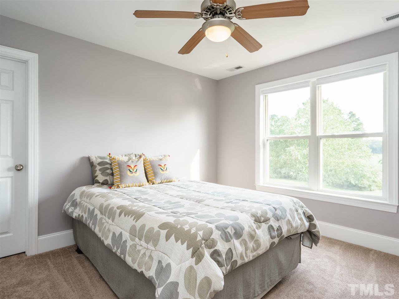 95 Rand Road Raleigh, NC 27603 - Photo 15 of 25 a bedroom with a bed and window