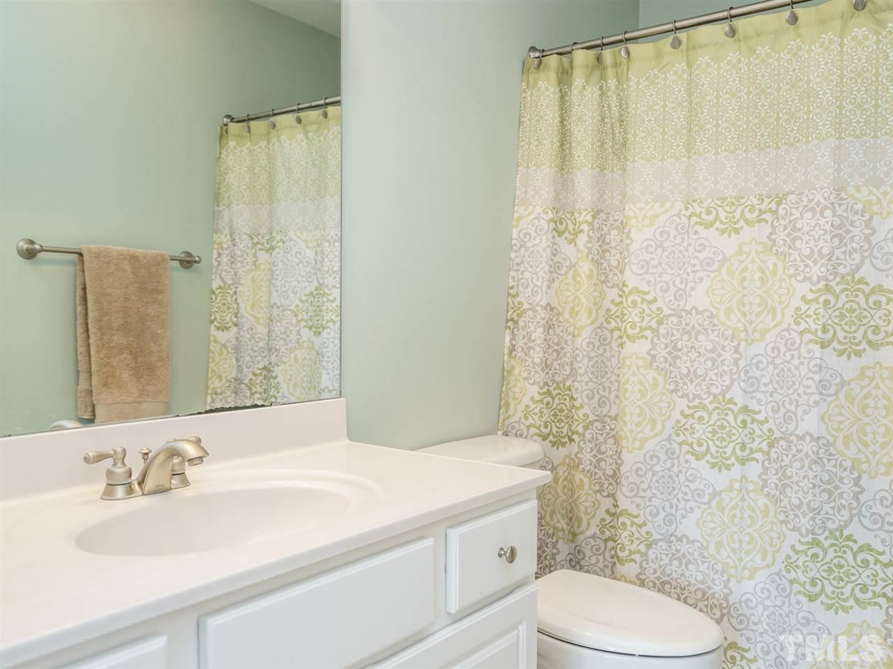 95 Rand Road Raleigh, NC 27603 - Photo 16 of 25 a bathroom with a sink toilet and shower