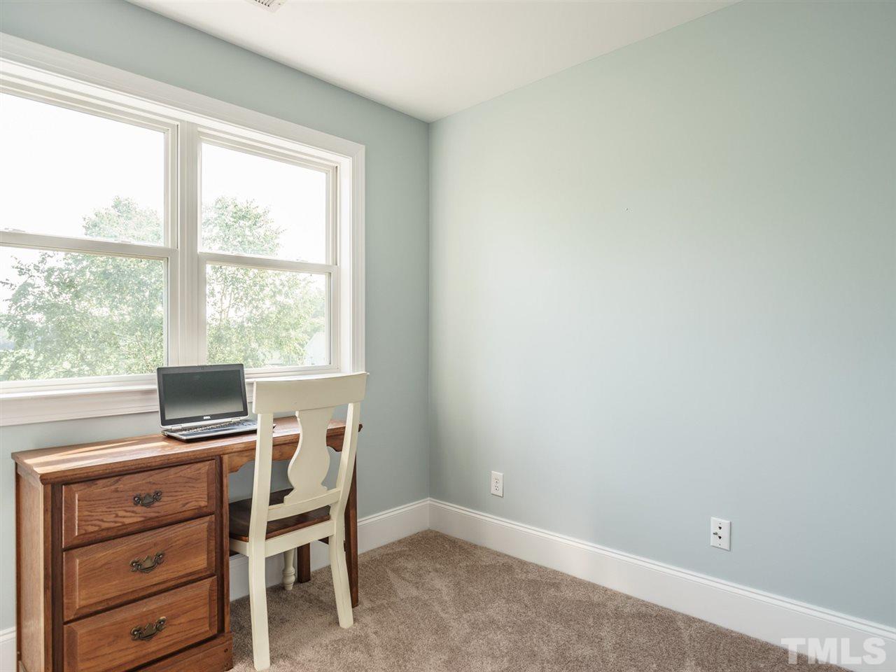 95 Rand Road Raleigh, NC 27603 - Photo 17 of 25 a view of a workspace with furniture and a window