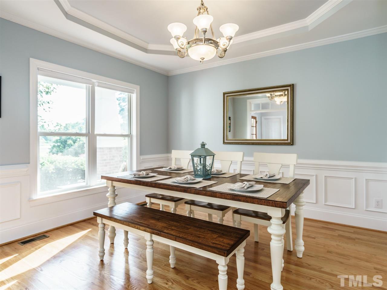 95 Rand Road Raleigh, NC 27603 - Photo 3 of 25 a view of a dining room with furniture window and wooden floor