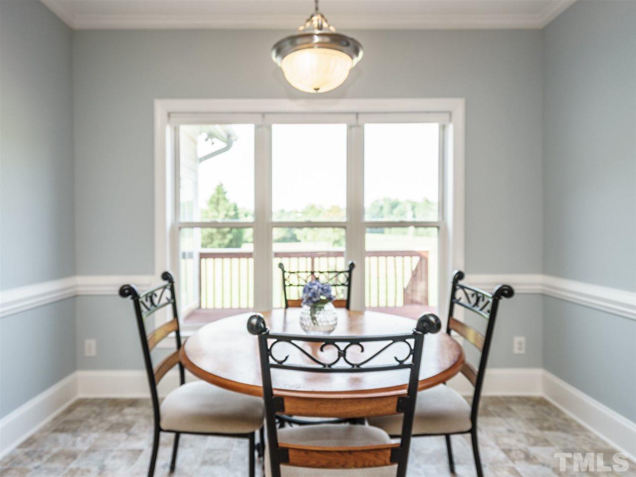 95 Rand Road Raleigh, NC 27603 - Photo 7 of 25 a view of a dining room with furniture window and outside view