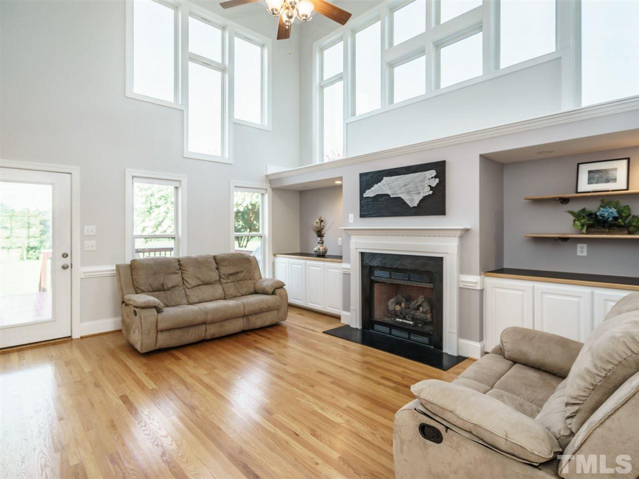 95 Rand Road Raleigh, NC 27603 - Photo 8 of 25 a living room with furniture and a fireplace