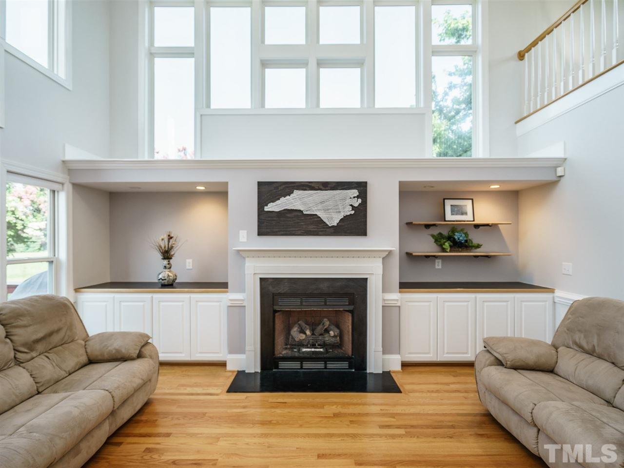 95 Rand Road Raleigh, NC 27603 - Photo 9 of 25 a living room with furniture and a fireplace