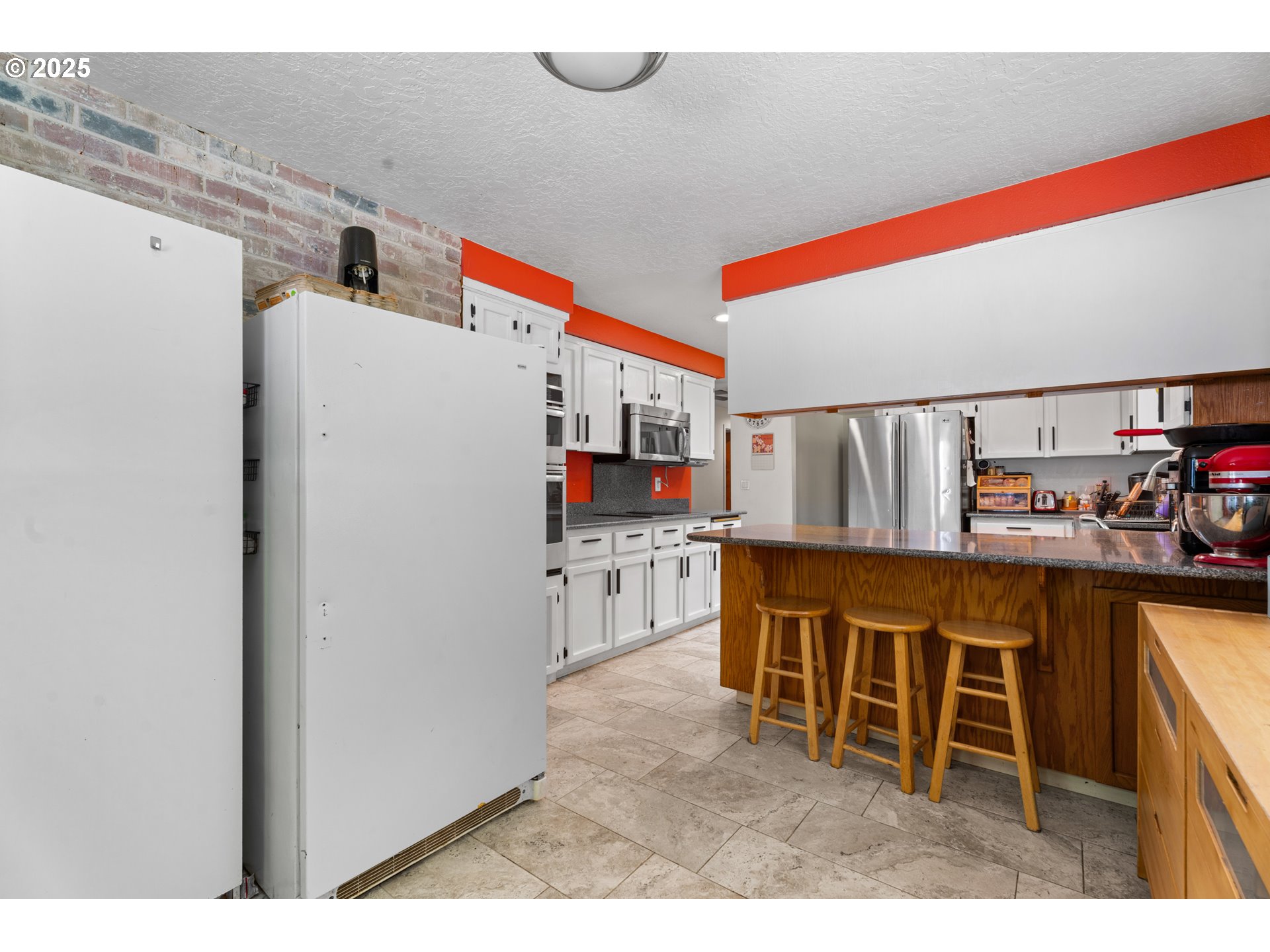 35650 Southeast Barnum Road Sandy, OR 97055 - Photo 20 of 35 a kitchen with stainless steel appliances granite countertop a refrigerator and a stove