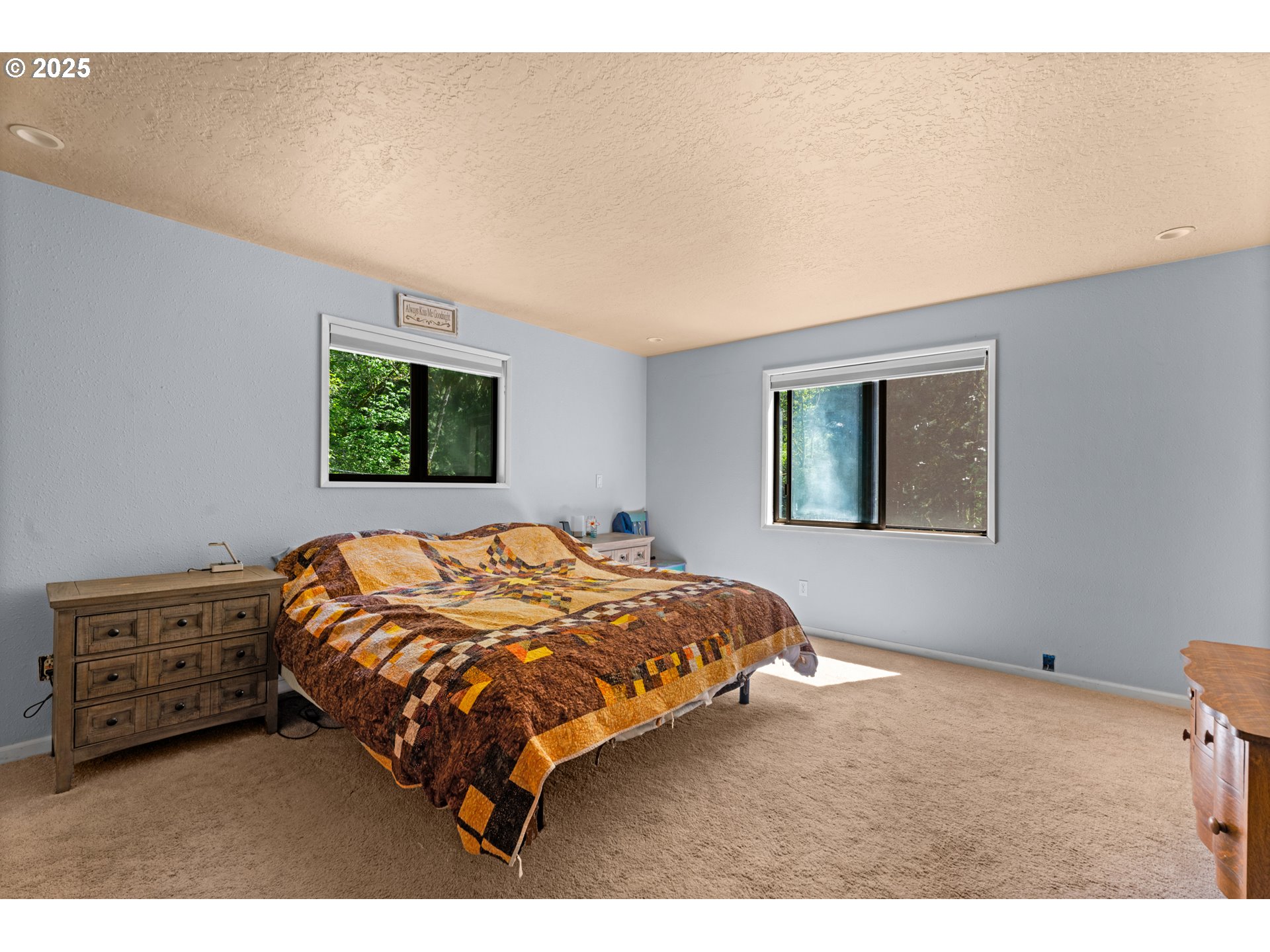 35650 Southeast Barnum Road Sandy, OR 97055 - Photo 26 of 35 a bed sitting in a bedroom next to a window